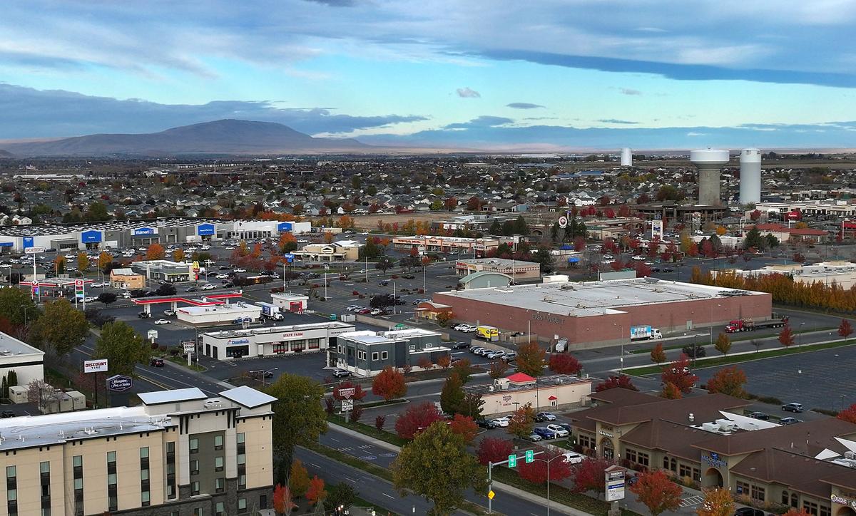 Commercial development on Road 68 in west Pasco with Rattlesnake Mountain and city water towers in view.
