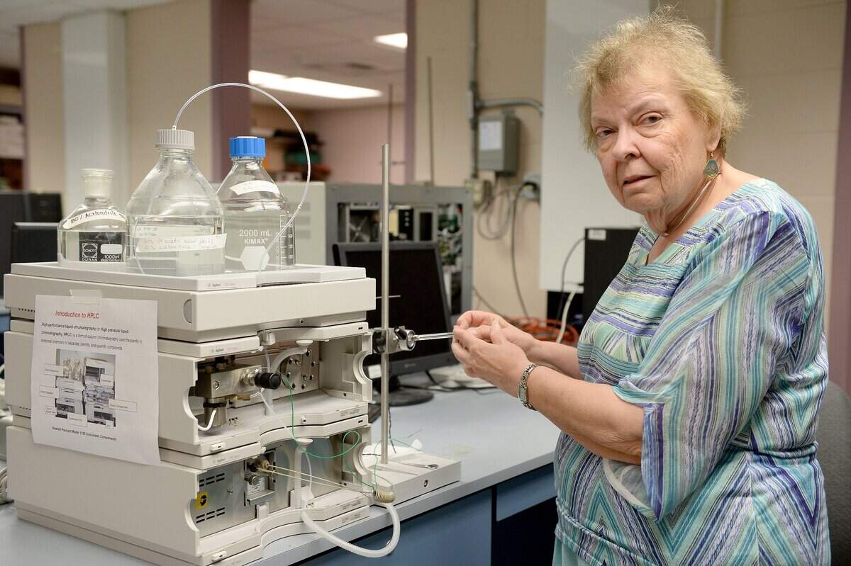 Columbia Basin College professor Karen Grant uses a high-performance liquid chromatography machine to separate, identify and quantify compounds in the colleges chemistry instruments laboratory. Grant, who started teaching at CBC in 1981, was inducted as a fellow to the American Chemical Society.