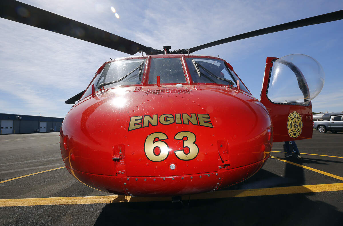 A firefighting Black Hawk from Northwest Helicopters sits on the tarmac at the Port of Benton's Richland Airport prepared to respond to wildfires.
