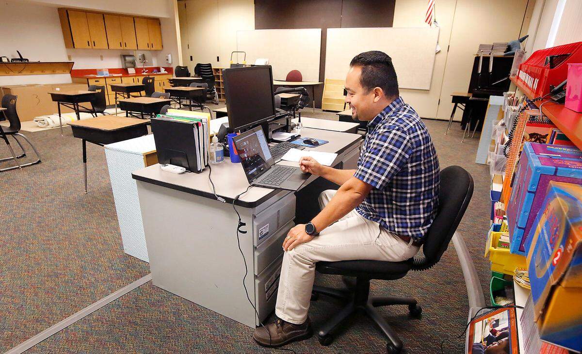 Second grade teacher Oscar Moyoroqui conducts an online video class session from his empty classroom at Captain Gray STEM Elementary School in Pasco during the coronavirus pandemic.