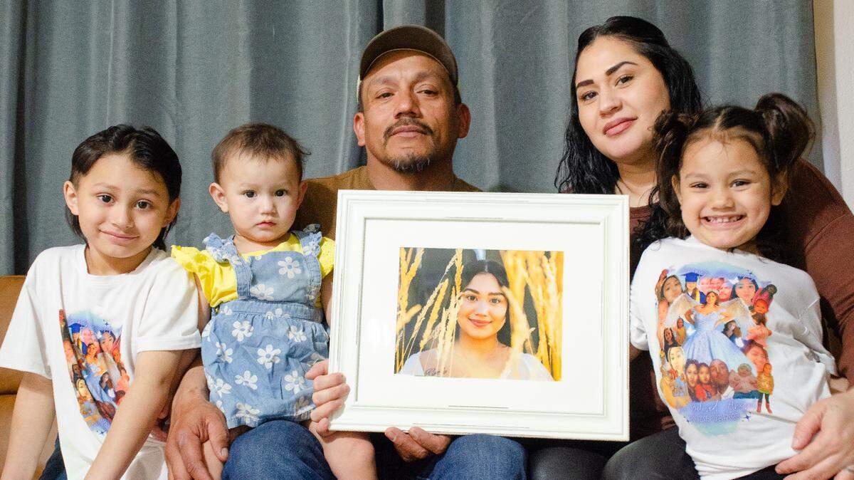 Gabriel Moreno and Angelica Reyes of Kennewick hold a photo in 2024 of their daughter, Maria, 17, who died in a car crash in November 2023. Their other kids are, from left, Gabey Jr., Cheyanne and Cherylnn.