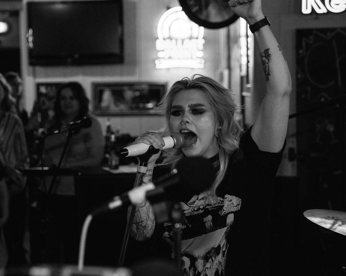 Vocalist of COBRAHAWK Lakyn Bury performs her signature scream at The Parkade in Kennewick in March 2022.