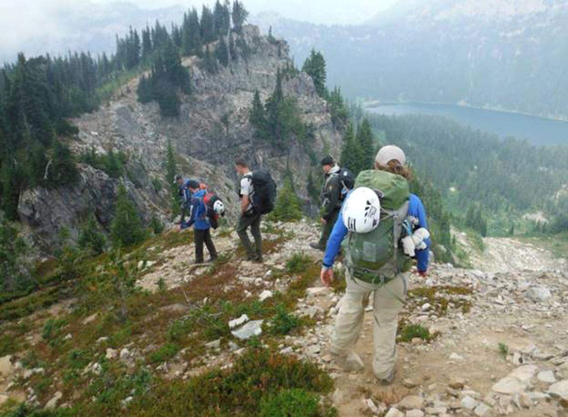 Accident investigators heading to the accident scene on Dewey Mountain in Mt. Rainier National Park two weeks after the accident.