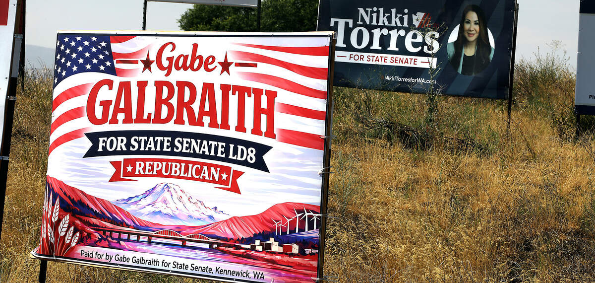 Campaign signs for state senate candidates Gabe Galbraith and Nikki Torres are displayed near each other at the Chapel Hill Boulevard and Road 68 intersection in west Pasco.