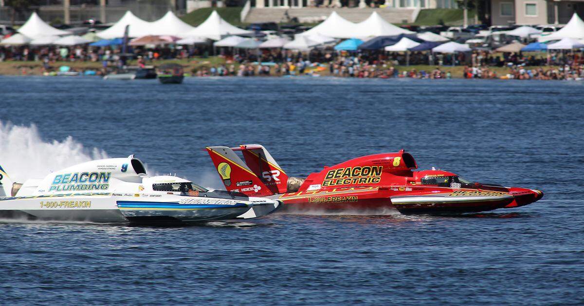 Teammates Corey Peabody in the U-9 Miss Beacon Plumbing unlimited hydroplane and J. Michael Kelly in the U-8 Miss Beacon Electric battle for position during Heat 4B Sunday on the Columbia River. Peabody pulled away to claim victory in the heat race.