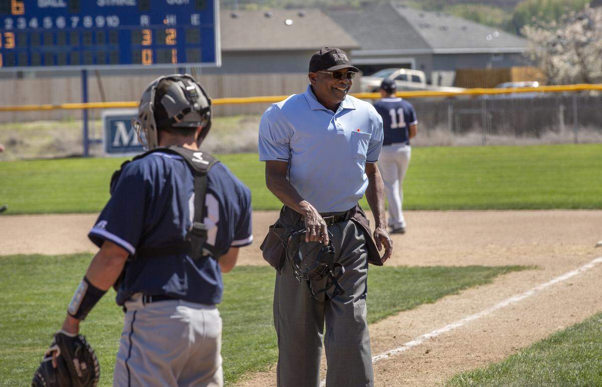 Greg Mitchell officiates a high school baseball game at La Pierre Field on Friday in Kennewick. Mitchell has been a sports official for over 30 years and has started the CJ Mitchell Sports Officials Academy.