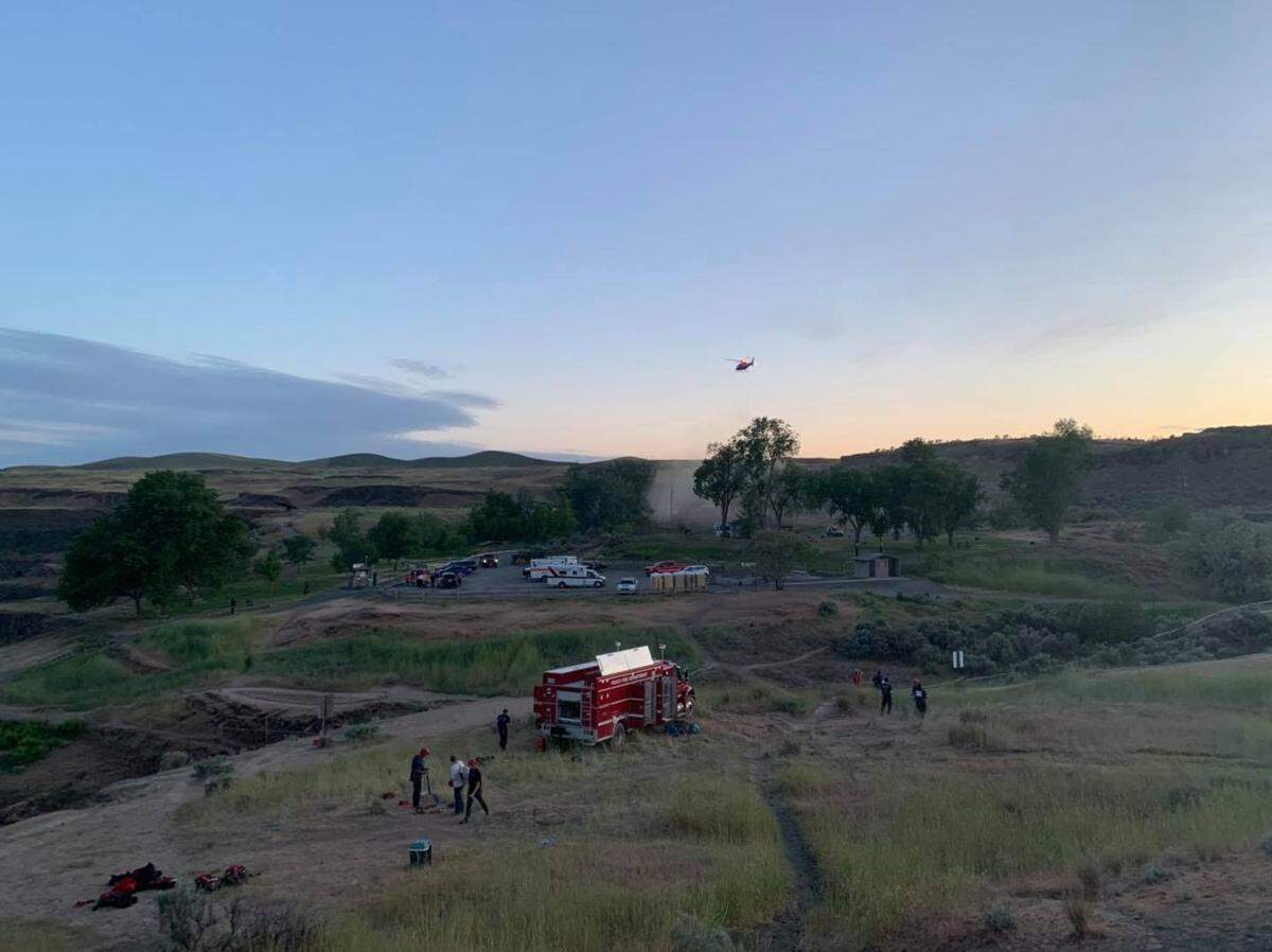 A Life Flight helicopter lifts off to take the hiker to a Richland hospital just as the sun is setting.