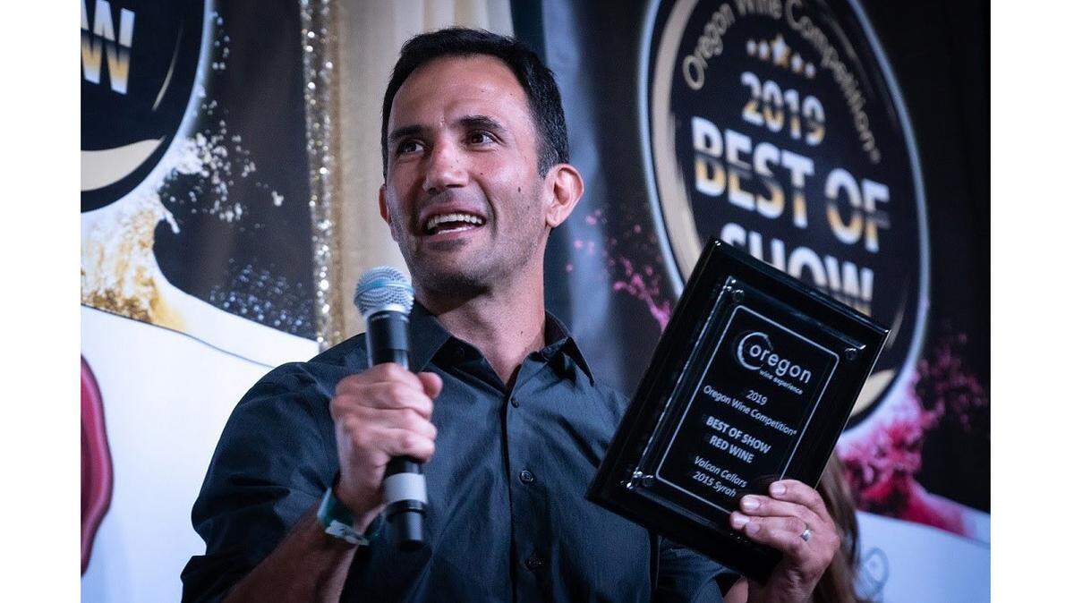 Juan Pablo Valot celebrates his Best of Show award for his Valcan Cellars 2015 Syrah at the 2019 Oregon Wine Competition.
