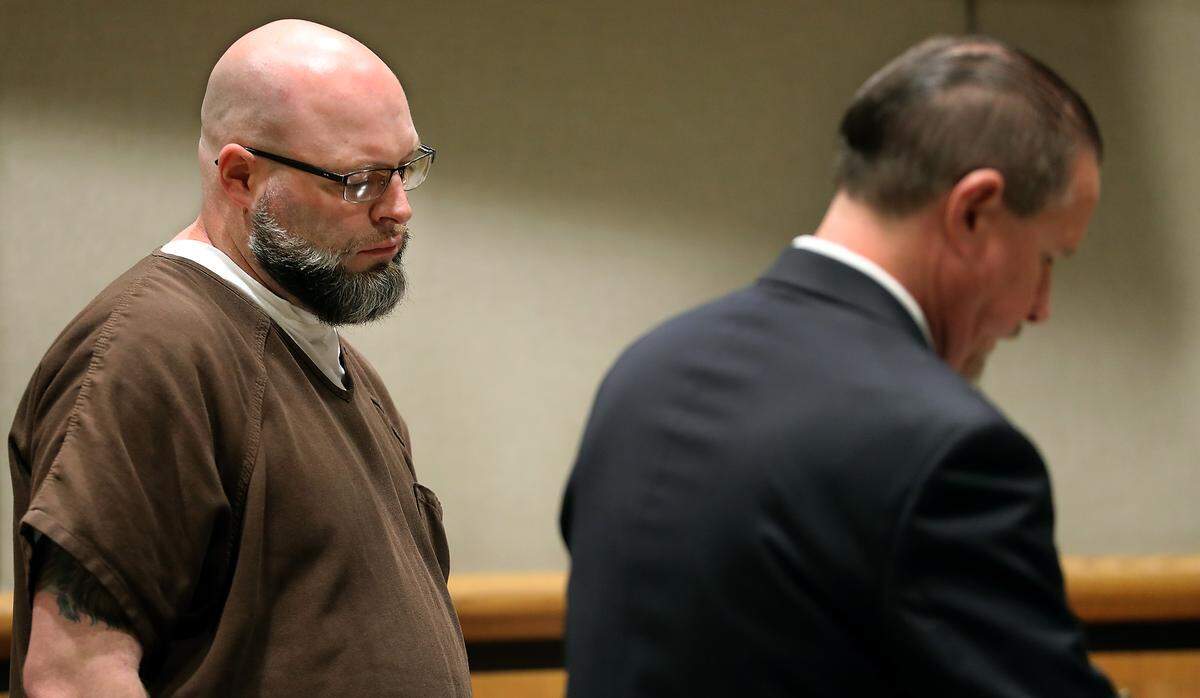 Kyle S. Pierce, left, stands next to his defense attorney Randall Jameson in Benton County Superior Court during his sentencing on four counts of indecent liberties for sexually touching female clients while working as a massage therapist at two different businesses in Richland.