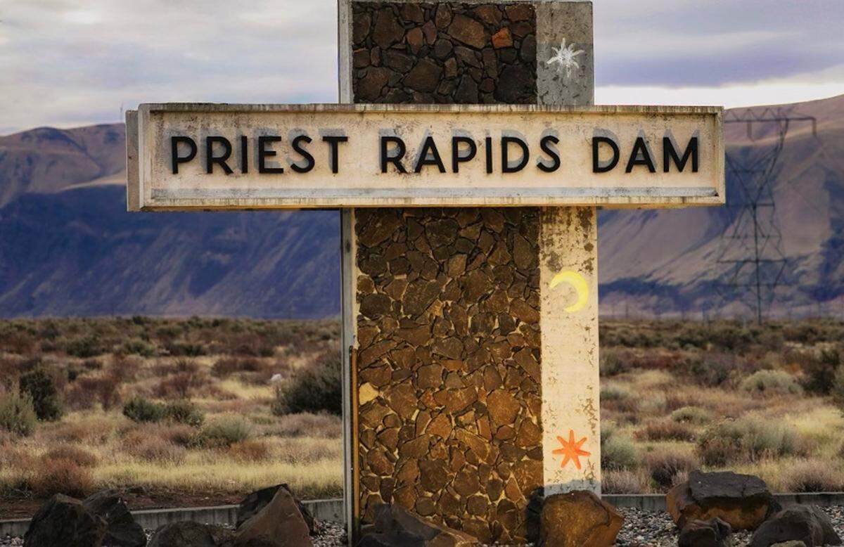 A sign marks the entrance to Priest Rapids Dam on the Columbia River. The hydroelectric facility, owned and operated by Grant PUD, is located northwest of the Tri-Cities.