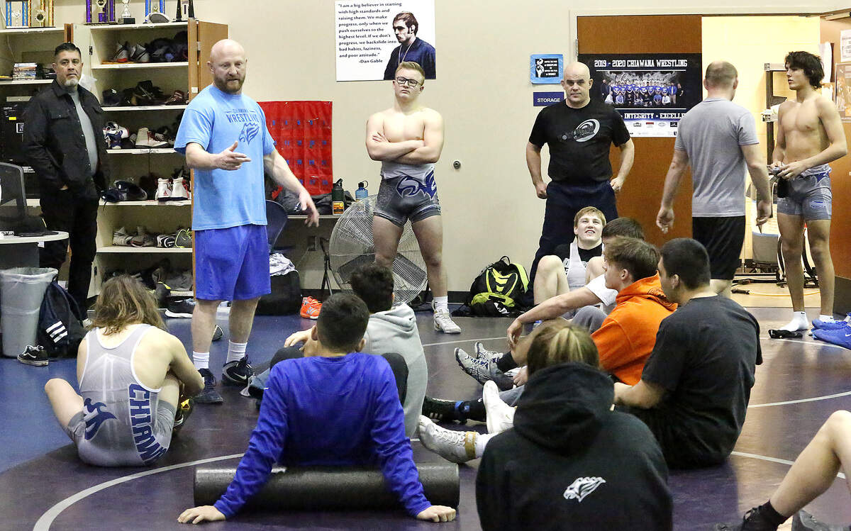 Chiawana wrestling coach Jack Anderson talks to his team at the start of practice in the final week before traveling to Tacoma to defend their 4A state championship. The Riverhawks will take nine wrestlers to Tacoma, four of them regional champs. Watch a video at: tricityherald.com/video