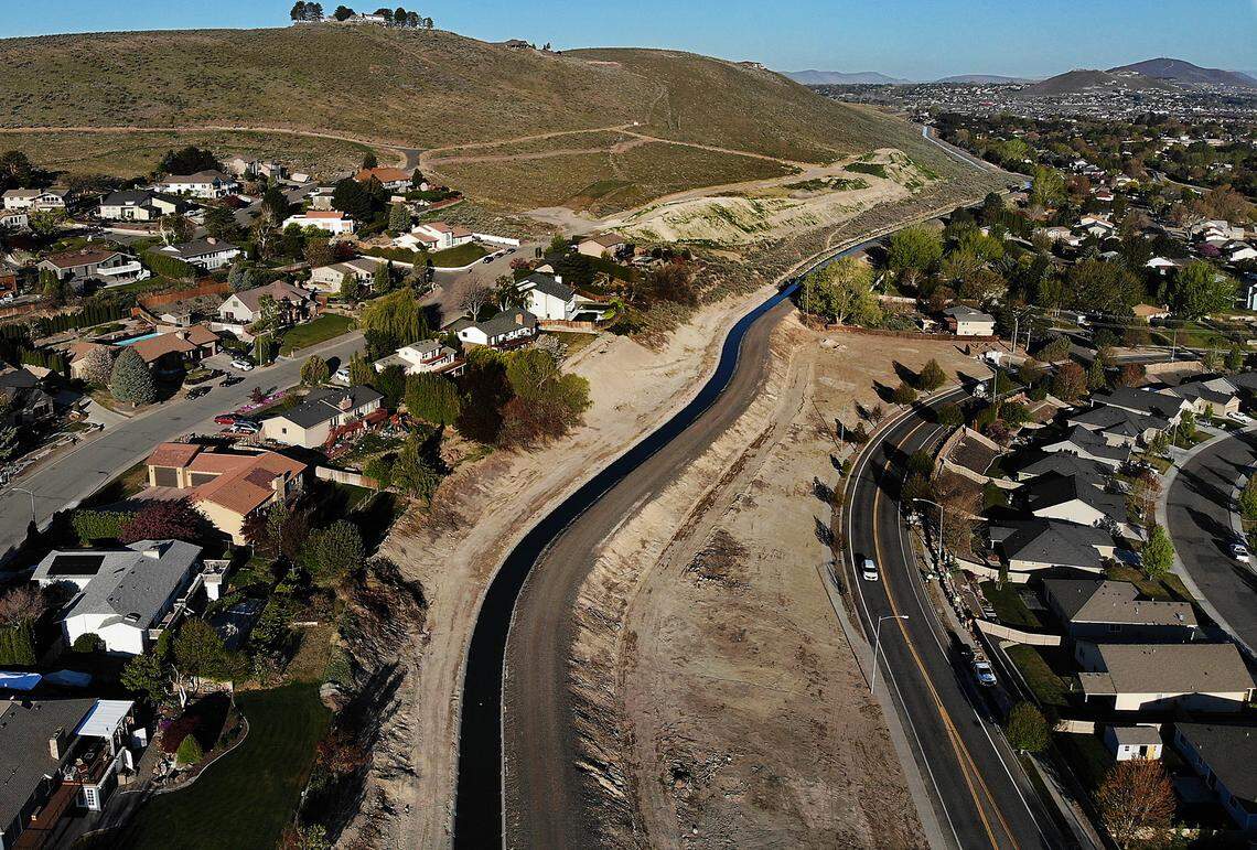 The KID irrigation canal runs along the base of Thompson Hill past Panoramic Heights and Creekstone housing developments in Kennewick. 