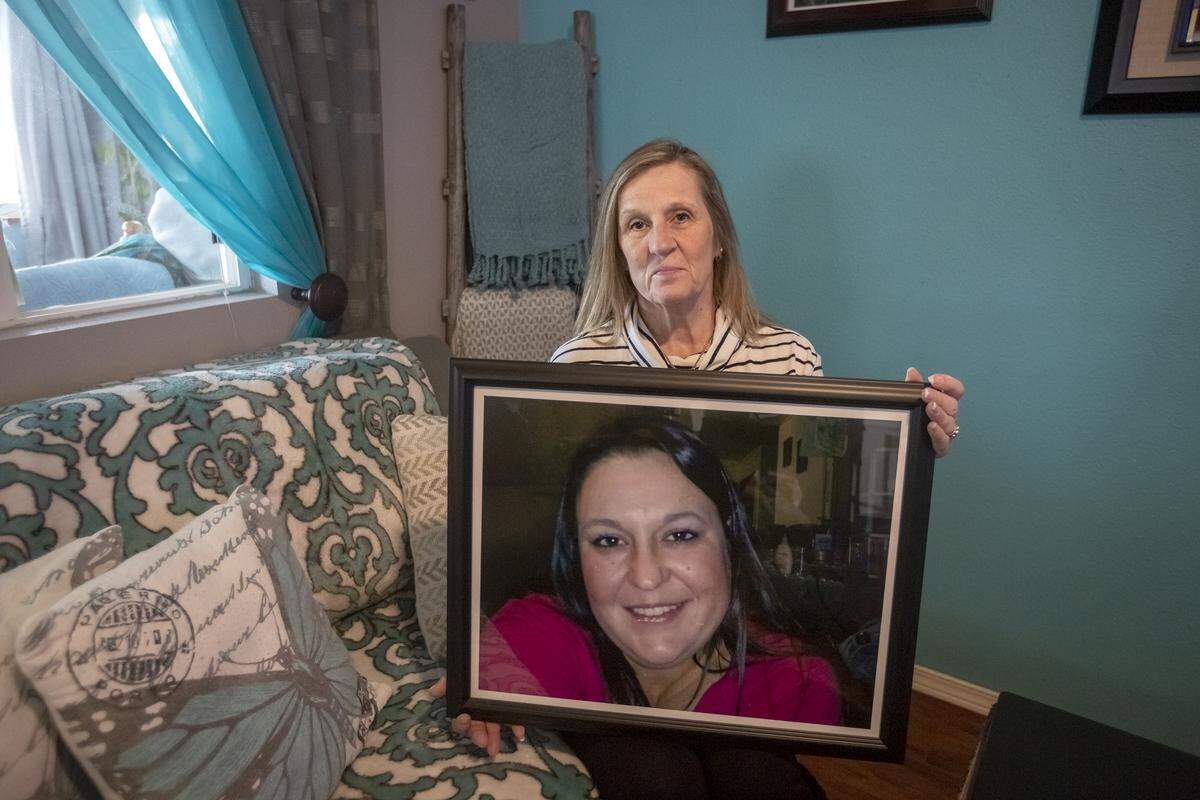 Rhonda Nissen holds a photos of her daughter, Christina “Tia,” inside of her home in Kennewick. Nissen is working to change a law that doesn’t allow parents to sue for wrongful death when adult children die by negligence.