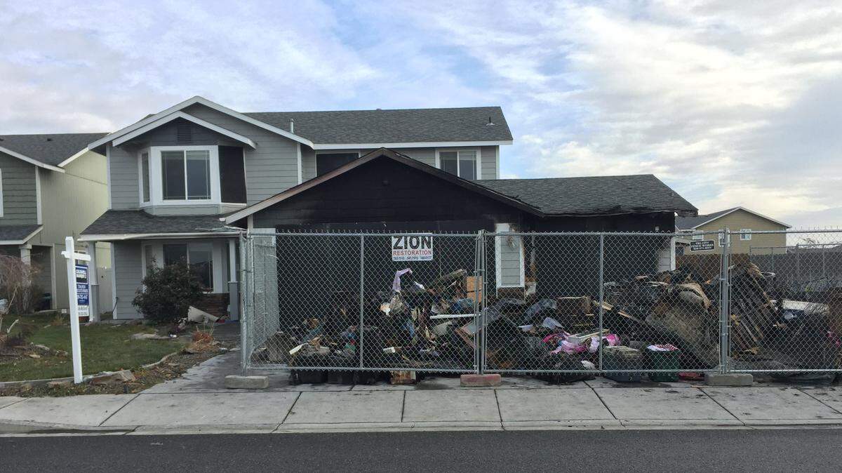 Household goods were pulled out of a house at 4703 Atlanta Lane in Pasco after a fire Thursday evening.