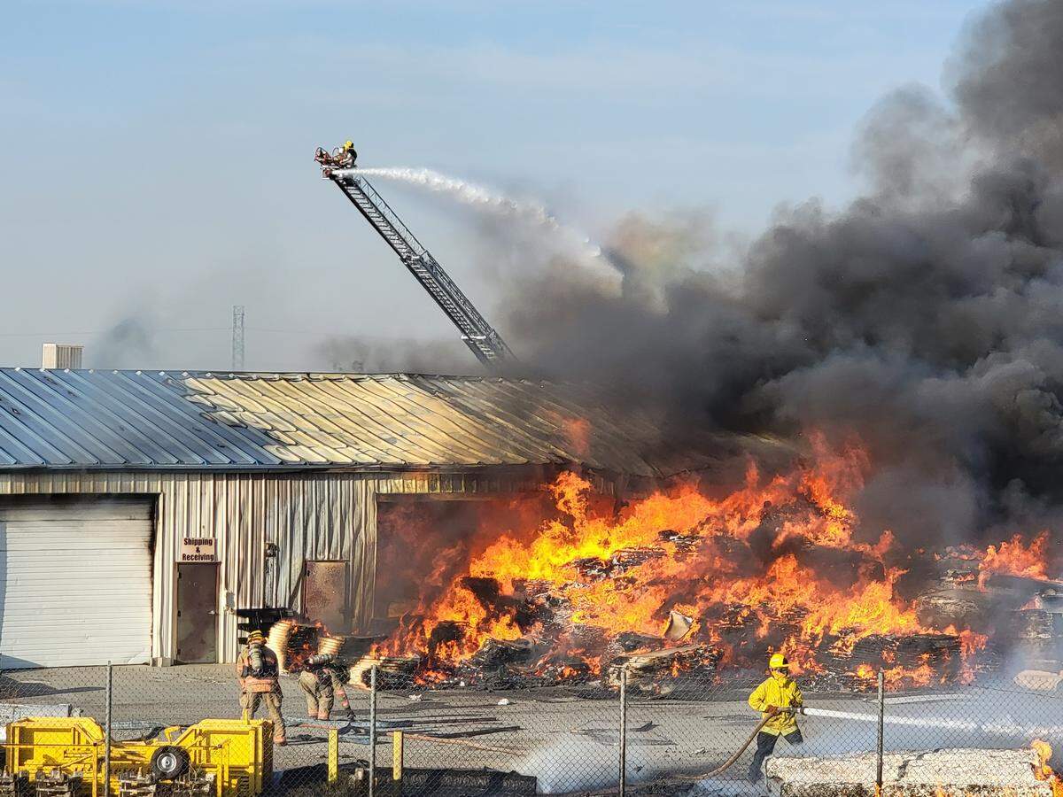 The wildfire spread to the CentiMark Roofing Company’s equipment yard and threatened several homes south of Southridge High School in Kennewick.