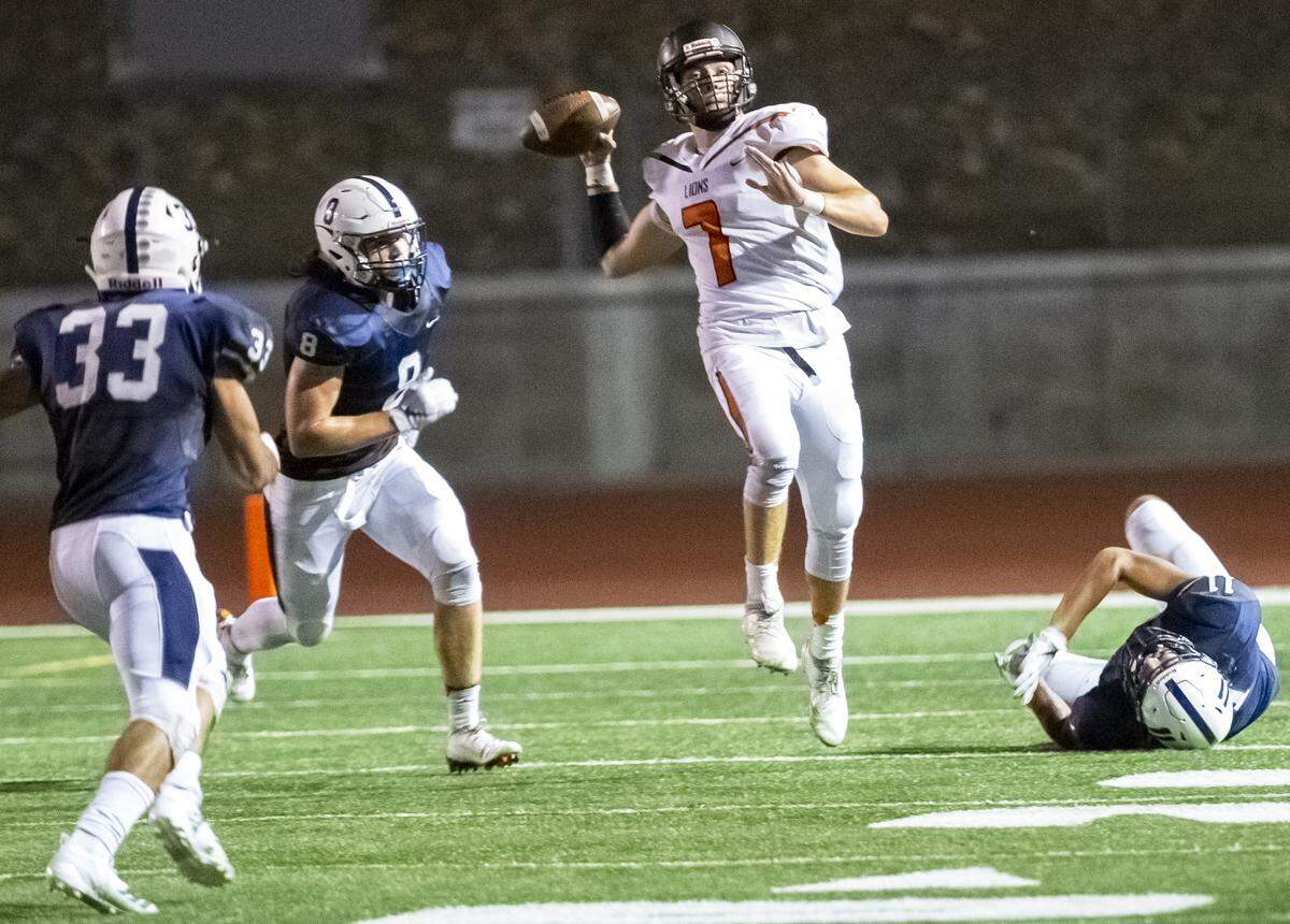 Kennewick Lions quarterback Blaine Chavez (7) throws a pass during a Mid-Columbia Conference high school football game against Chiawana at Edgar Brown Stadium in Pasco on Friday. Chiawana won 37-0.