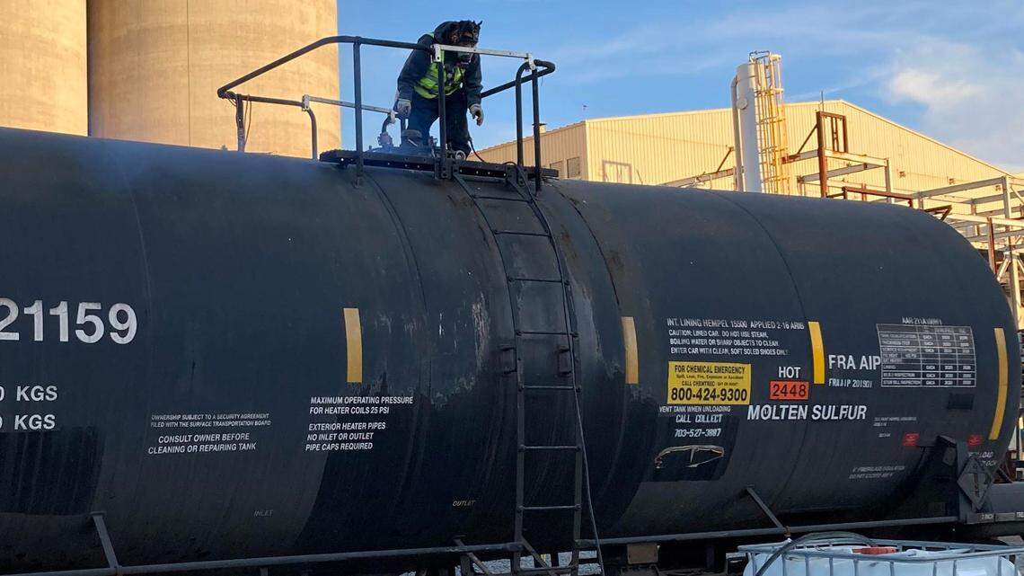 State inspectors saw a column of blue smoke escape from a hatch as its bolts were loosened at a Moses Lake, Wash., chemical processing plant.
