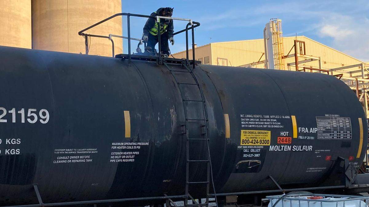 State inspectors saw a column of blue smoke escape from a hatch as its bolts were loosened at a Moses Lake, Wash., chemical processing plant.