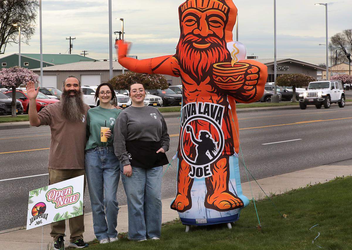 The Rodriguez sisters designed their waving inflatable to resemble their father, Cedro, for their new family coffee shop Java Lava Joe on Columbia Drive in Kennewick.