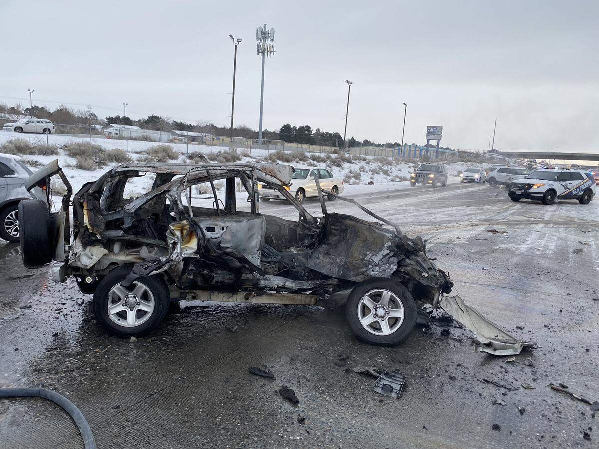 Westbound traffic on Interstate 182 in Richland was delayed for four hours Thursday morning when a car caught fire after crossing the median and crashing into a semi truck and trailer.