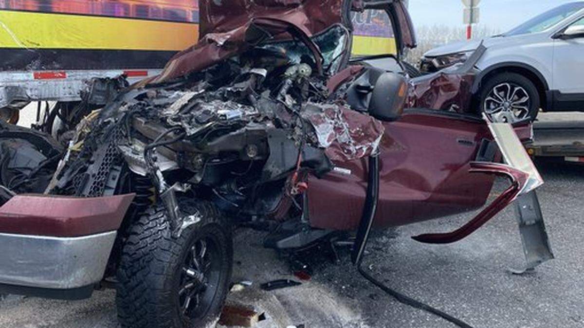 A pickup slammed into the side of a semi truck and trailer Thursday at Foster Wells Road and Highway 395.