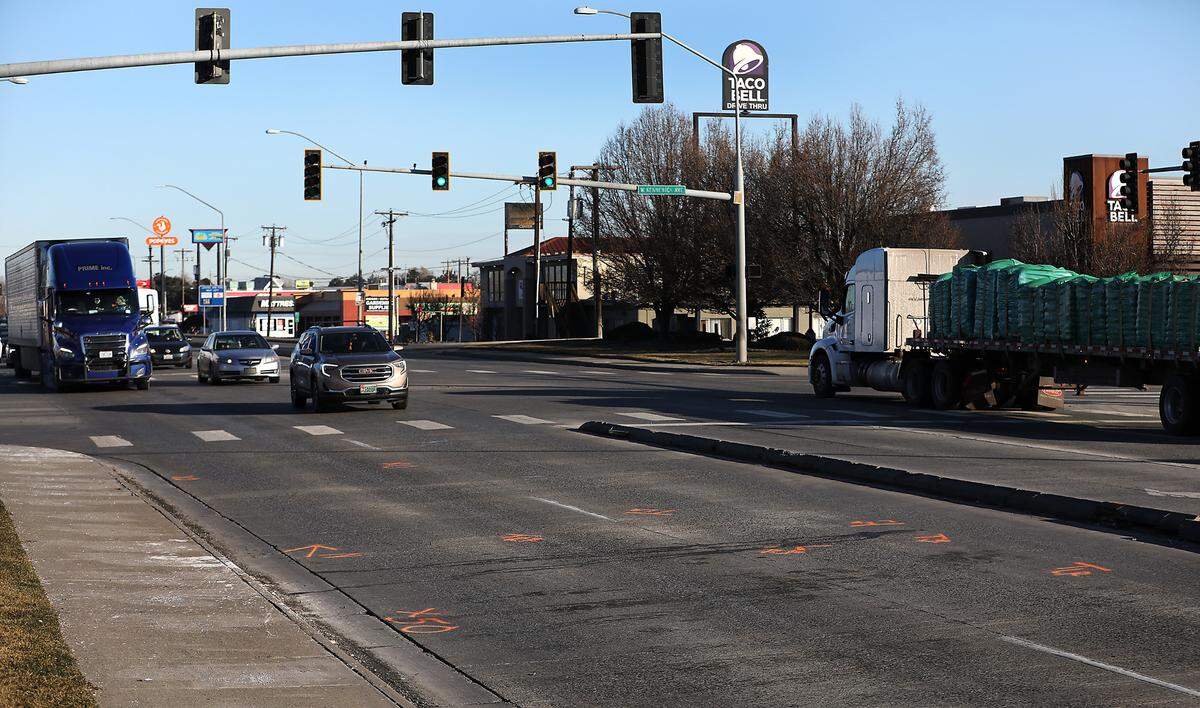 Investigative paint markings mark the location on Highway 395 at West Kennewick Avenue.