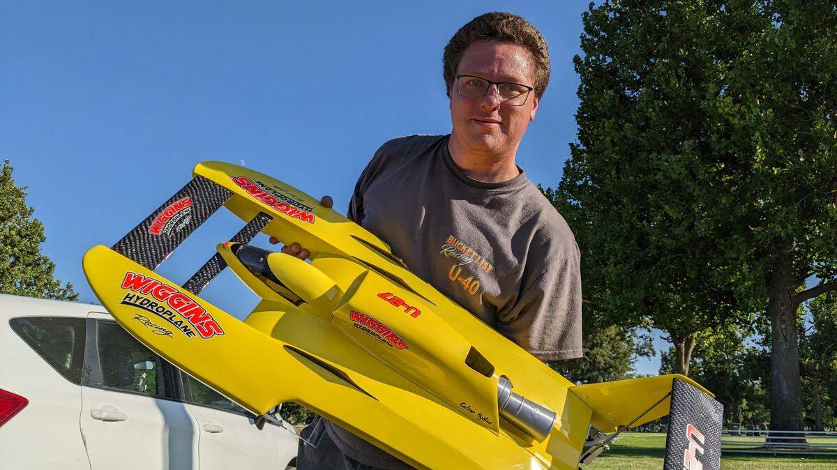 Jason Colean of Pasco shows his one-tenth scale yellow RC hydroplane. Dozens of super fans and enthusiasts of the annual Water Follies Columbia Cup races gathered early to prep for the weekend races.