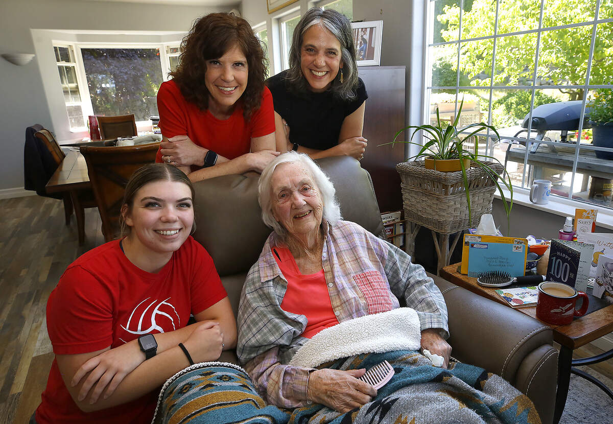 Kennewick resident Margaret Racy celebrates her 100th birthday Friday. She is surrounded in this photo by family members, from left: Meredith Thompson, 22, Michelle Thompson, 55, and Rea Culwell, 53.