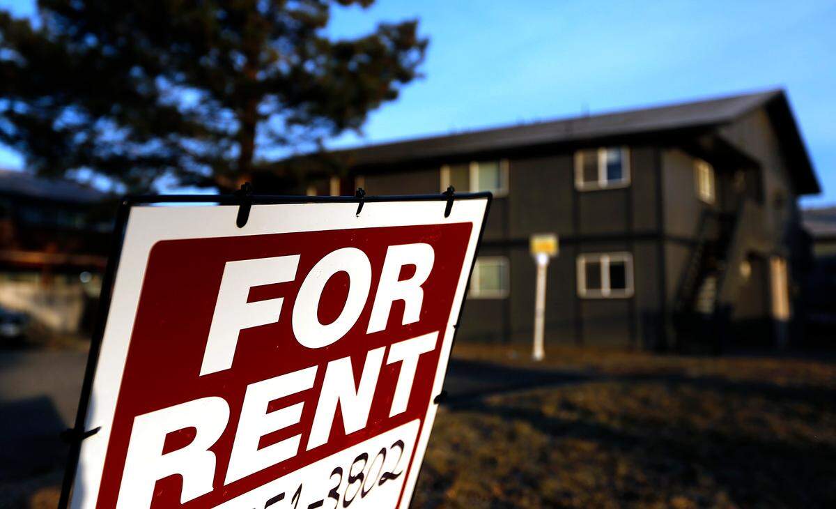 A rental sign is on display outside an apartment complex in Kennewick.