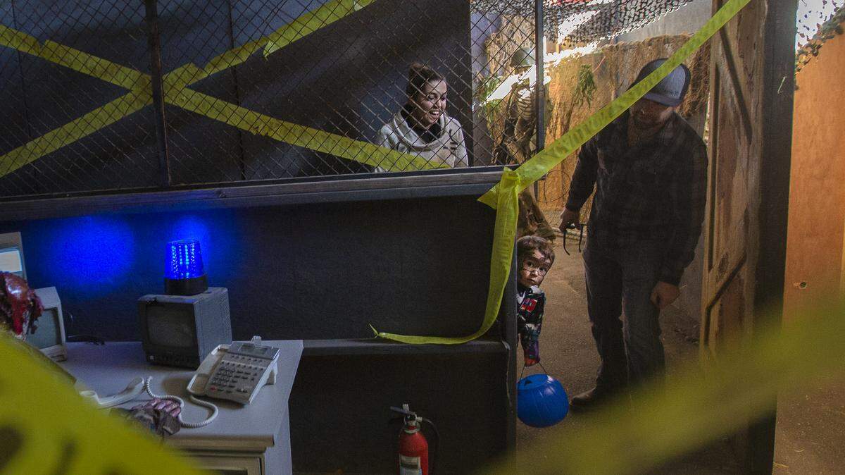 Three-year-old Mason Allen, dressed as a Transformer, peers around a corner to see a zombie as he goes “The Infection” during Scarefest at the Benton County Fairgrounds in Kennewick on Saturday. It was kid’s day. Mason was accompanied by his mother Tressia Nowlin and her boyfriend Erik Killand. Scaregrounds will continue Oct. 18-20, 25- 27, and the 31. Tickets are $15.