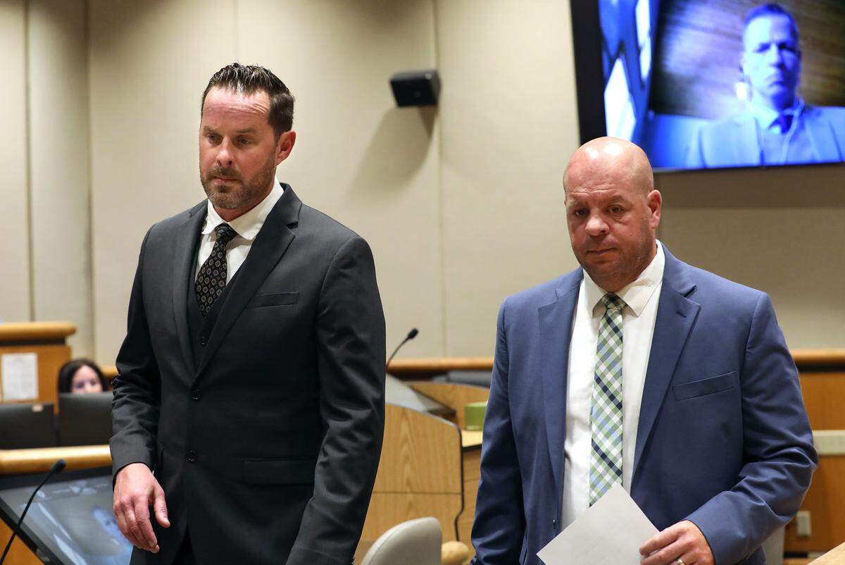 Benton County Commissioner Will McKay, left, leaves a Benton County Superior Courtroom with his defense attorney Nick Jones.
