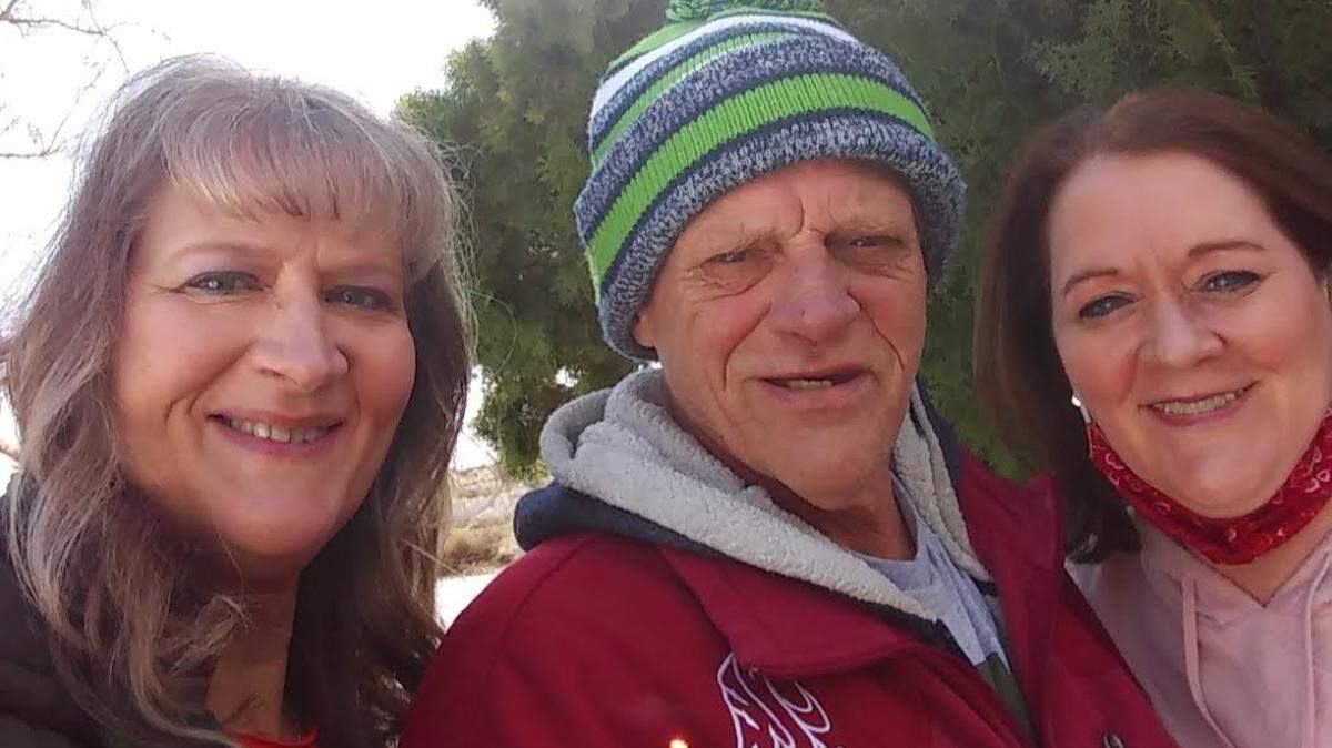 Brian Hoffman, of Pasco, is shown with his sisters, Susan Burggraaf of Alpine, Utah, (left) and Lisa Nealey of Redmond, Wash. Nealey became his legal guardian and filed a lawsuit after the disabled man was sold a car costing far more than he could afford.