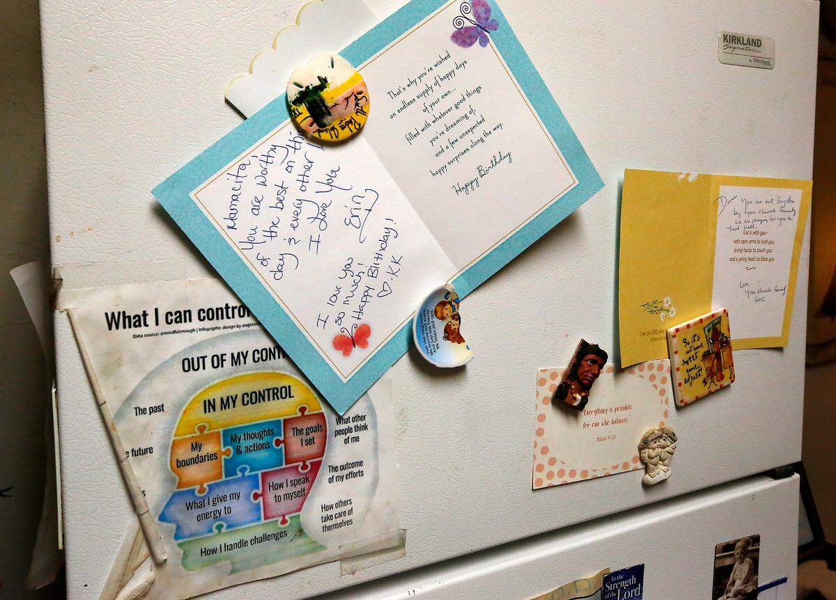 Diane Alaniz Anzar displays meaningful greeting cards and other items on her refrigerator door in her supportive housing apartment in downtown Kennewick.