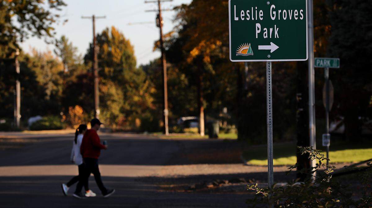 A pair of Richland residents walk across Harris Avenue to access Leslie Groves Park on Park Street along the Columbia River in north Richland.