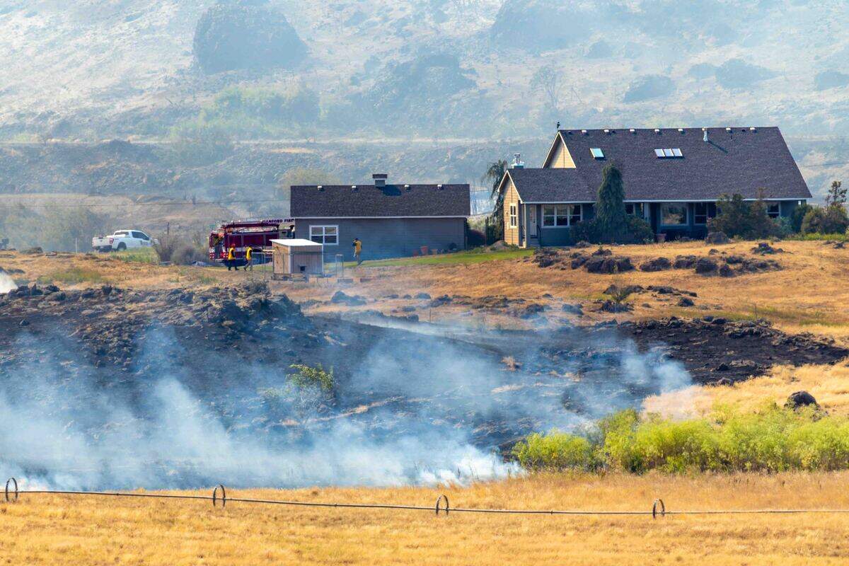 A fire east of Benton City was forcing some residents to be evacuated as it burned near the Old Inland Empire Highway just north of Interstate 82 on Sunday.