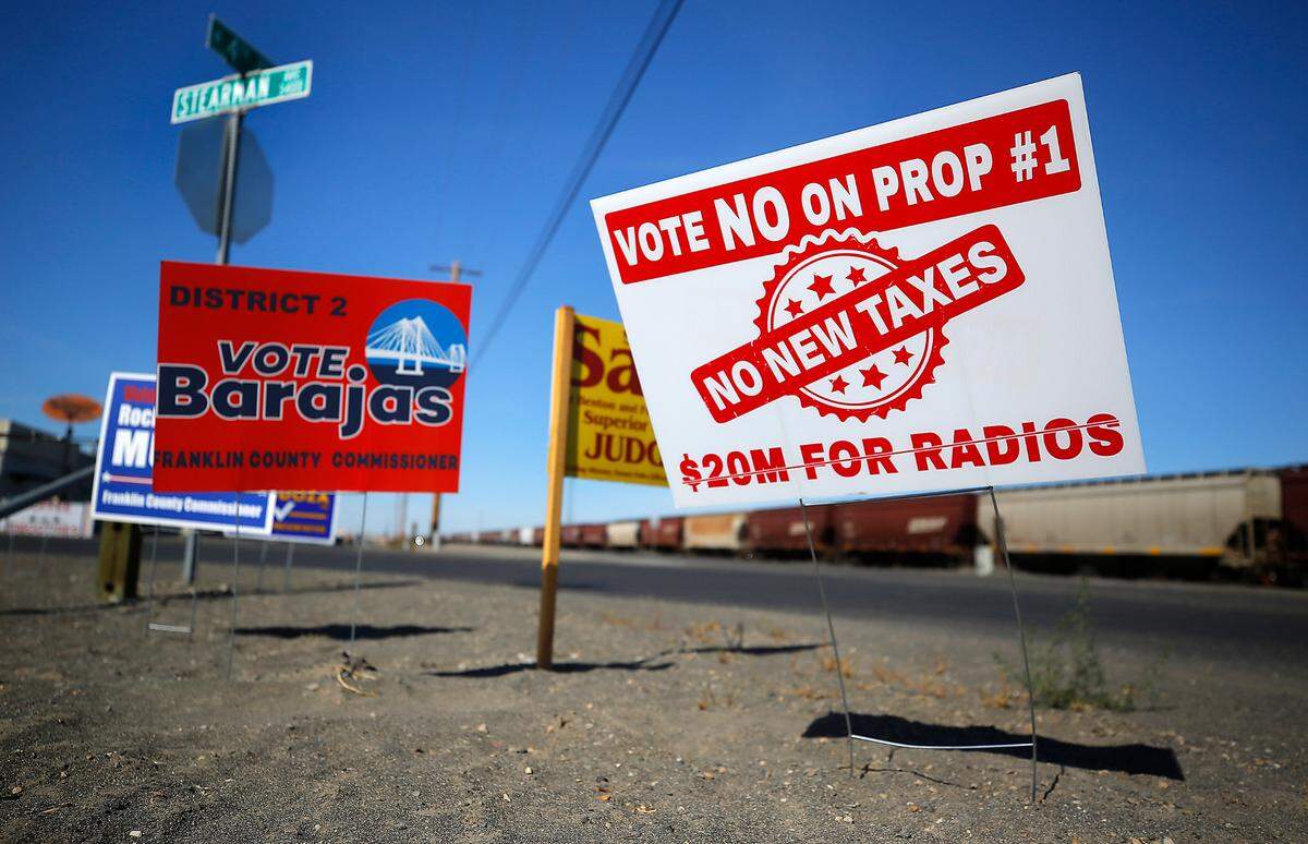 A sign with a message opposing Franklin County Proposition 1, a sales tax for emergency transmission upgrades, is posted on North Fourth Avenue in Pasco.