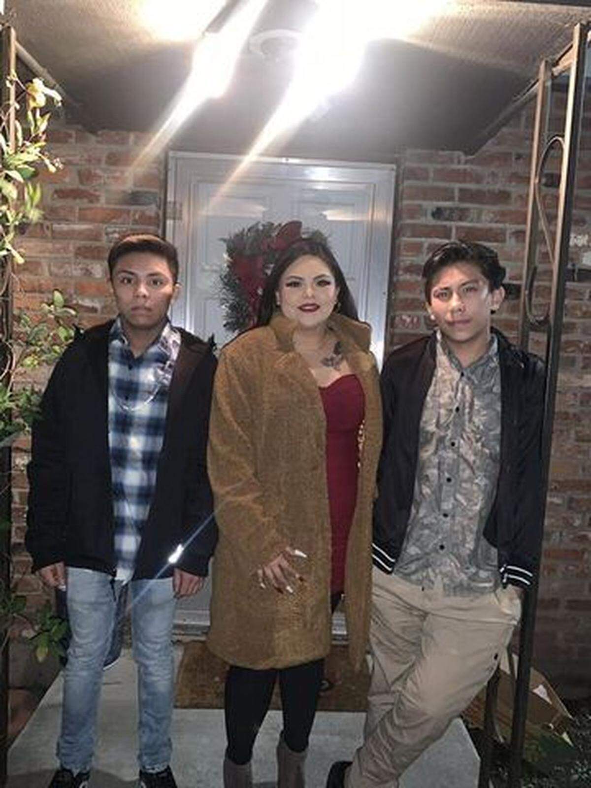 Marisol Sanchez, 29, of Kennewick, poses for a photo with her 19-year-old twin brothers, Eduardo Sanchez Cayetano, left, and Oscar, who was killed when a car jack slipped.