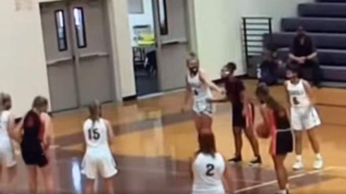 A Facebook video screenshot shows one of the free throw attempts during which calls of “monkey” were being made from the bleachers.