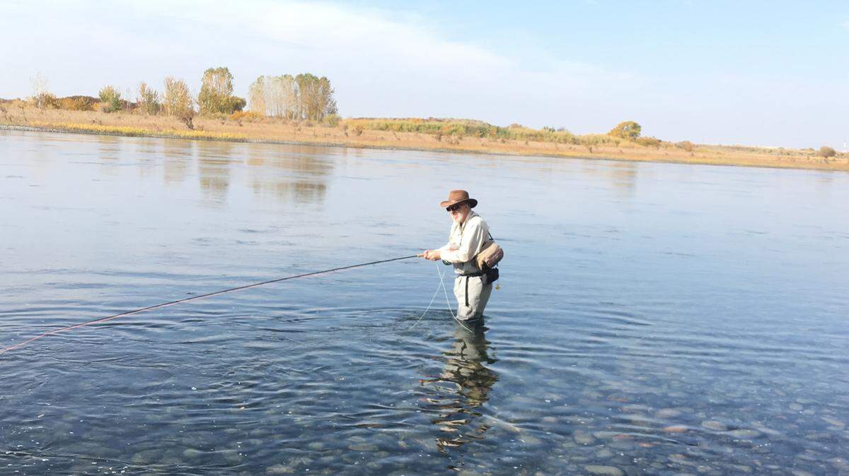 Ken Gano swings a fly for steelhead on a sunny fall day in the Hanford Reach.