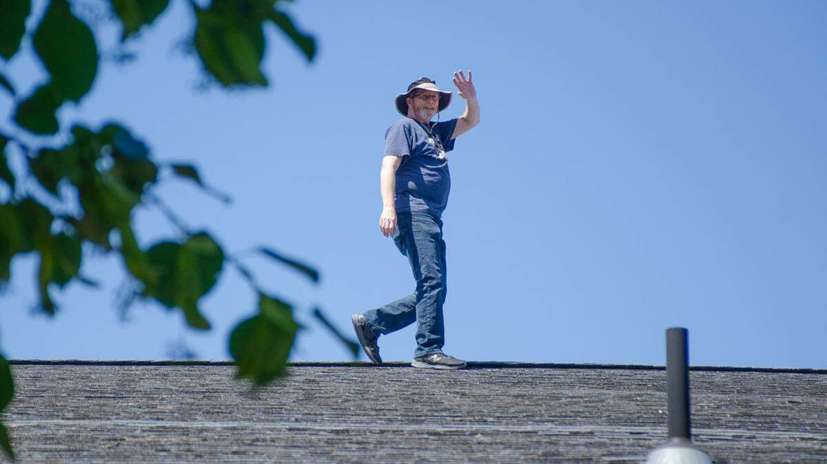 Liberty Christian School Superintendent Jim Cochran will spend two nights on top of the school with a tent, stove, food and supplies.