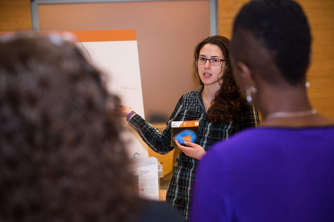 Megan Nims, a chemist at PNNL, shares an enlarged image of the rings that make up a fish’s ear bone as she describes how studying those rings can help determine a fish’s birthplace, migration and exposure to environmental contaminants.
