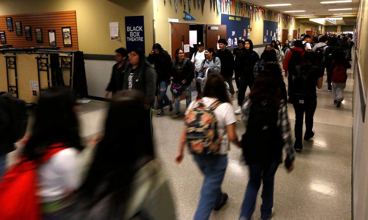 Congestion in a main hallway as students change classrooms at Chiawana High School in Pasco.