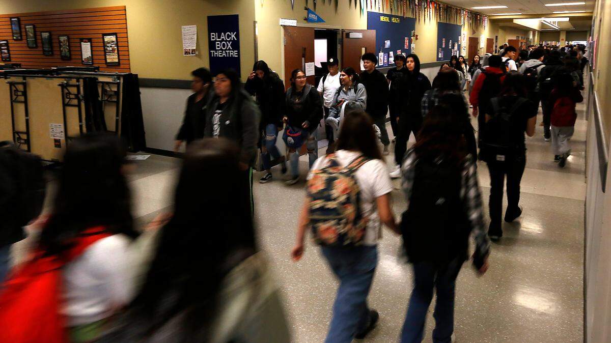 Congestion in a main hallway as students change classrooms at Chiawana High School in Pasco.