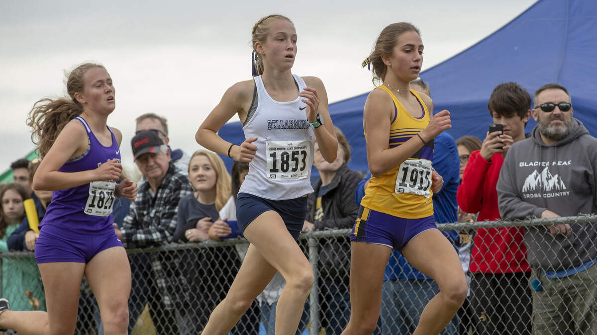 Freshman Ella Borsheim of Bellarmine Prep, center, competes in WIAA 4A girls cross country championship  at Sun Willows Golf Course in Pasco on Saturday. Borsheim won with a time of 17:36.10.