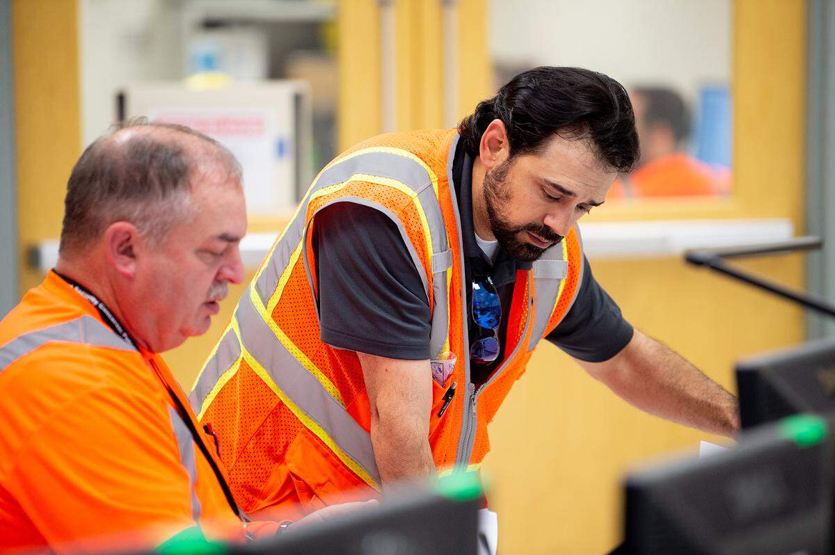 Hanford vitrification plant workers monitor systems inside a computerized control room in the recently completed annex of the plant’s Low Activity Waste Facility.