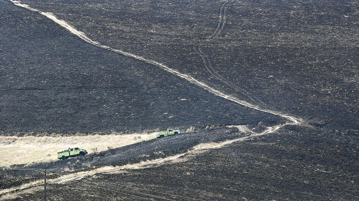 A group of Grant County District 5 fire trucks navigate their way up Lincoln Road Thursday morning along the east flank of the 2,500-acre Montecito Fire south of Prosser. A statewide mobilization of fire resources responded to the blaze that started the previous night. Watch a video at: tricityherald.com/video