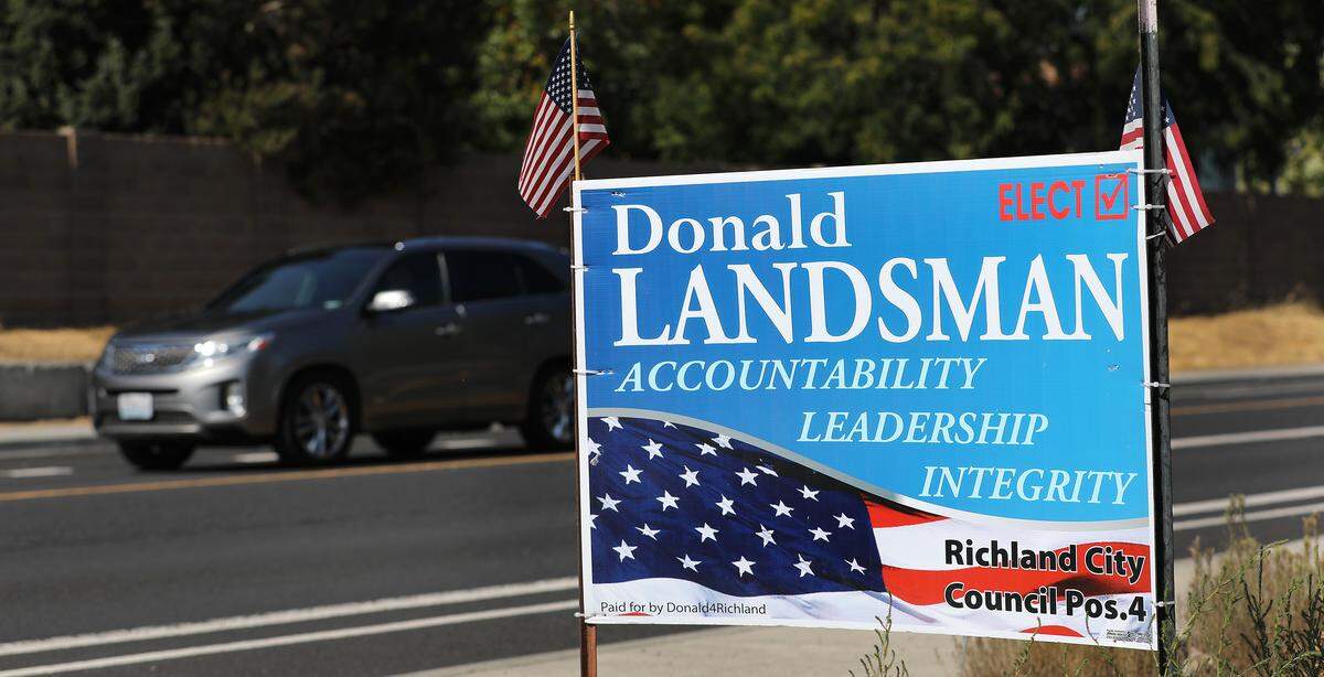 City council campaign signs for Donald Landsman remain posted along Leslie Road and elsewhere in Richland even after his death in August. His name will be on the November ballot.