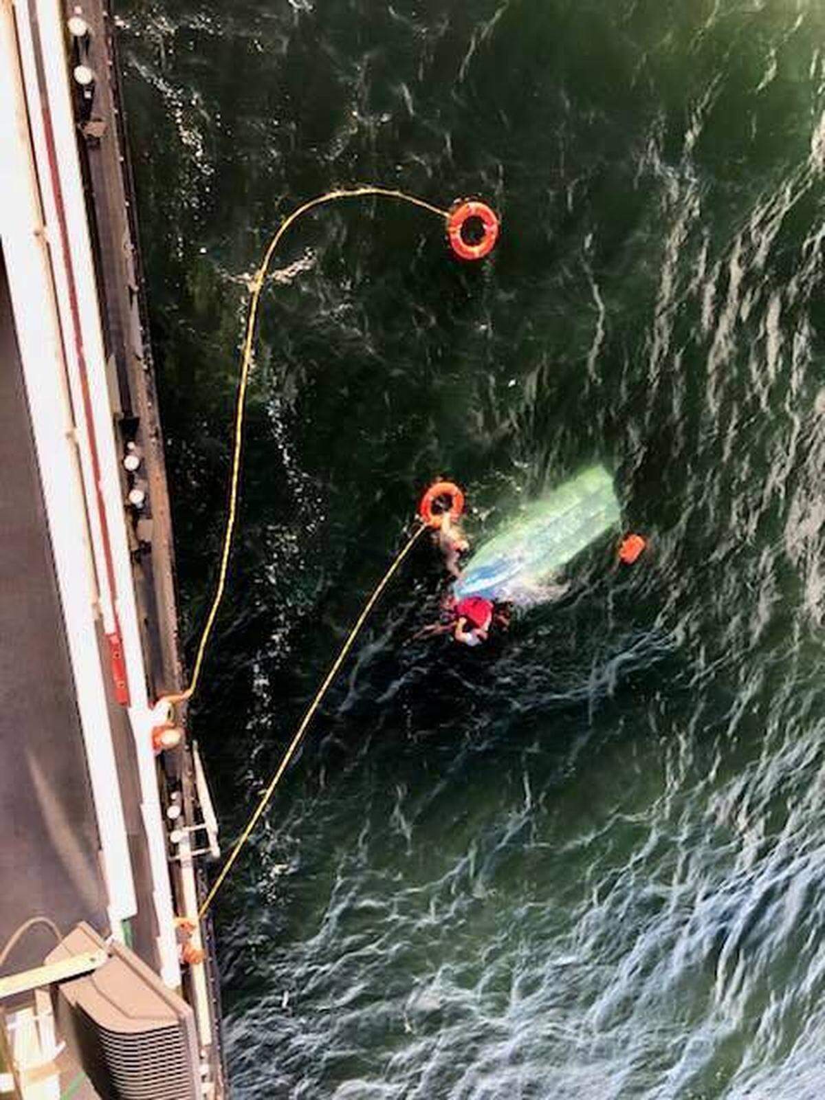 Two people clung to their overturned boat for three hours in the Columbia River Sept. 11 before they were rescued by a tugboat coming from Pasco.