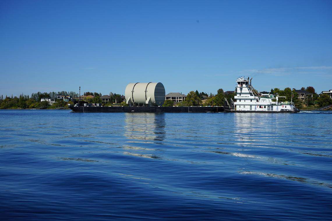 A U.S. Navy nuclear submarine reactor compartment, with fuel removed, is floated on the Columbia River through the Tri-Cities on its way to Hanford in October.