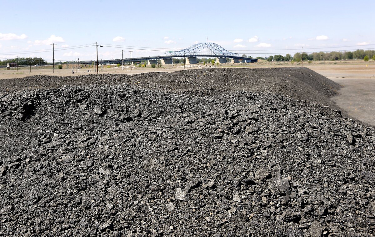Pavement grindings from area road work projects are piled in the vacant lot off North Kent Place near the blue bridge in Kennewick. The cleared property is known as Kennewick Gardens and planning is still underway to develop the site.